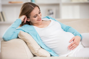 pregnant woman on couch